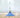 Blue commercial mop with handle on wood floor.