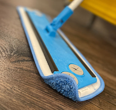 Microfiber flat mop with frame and handle on wood floor