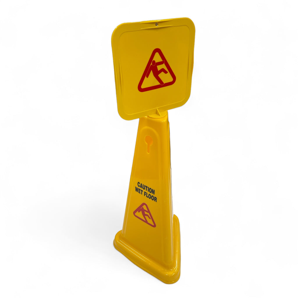 Large 'Wet Floor' caution sign in yellow standing against a white backdrop